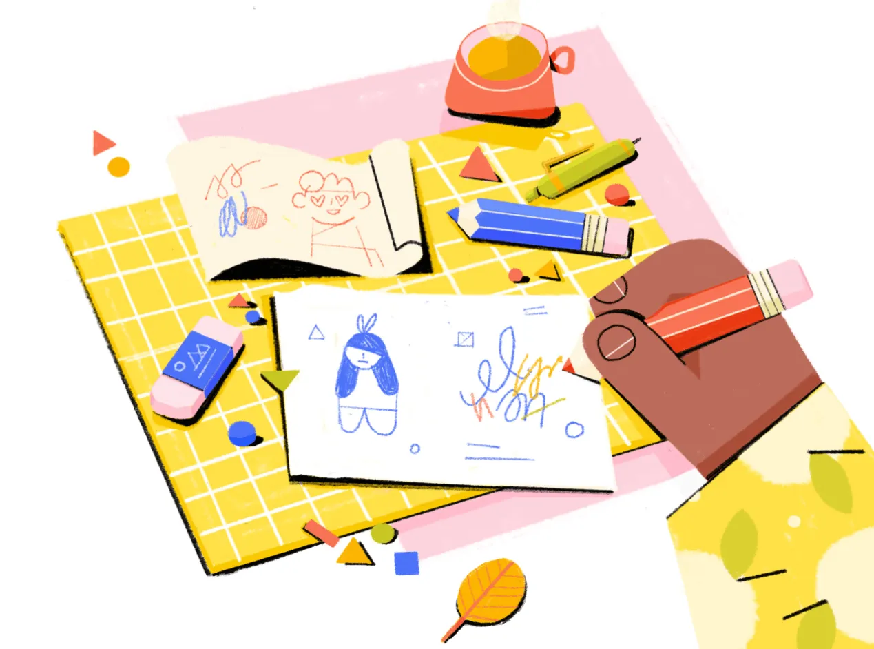 Colorful illustration of a hand drawing on paper: a workspace with crayons, an eraser, sketch pages (with doodles), and a cup of drink, set on a yellow checkered mat—bright, playful art style.